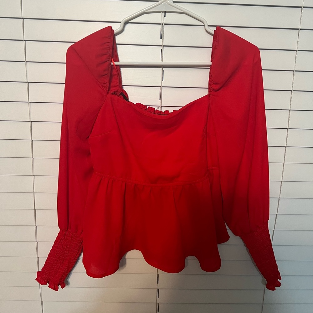 Francesca’s red top